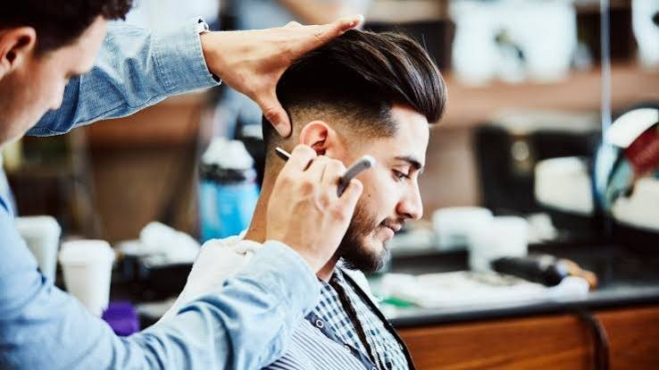Combing a pompadour into its final shape